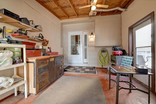 Enclosed porch area off the patio that can be used as a mud room, sitting area, whatever you'd like. It's vented and has a ceiling fan as well as a doors leading to the patio and garage.