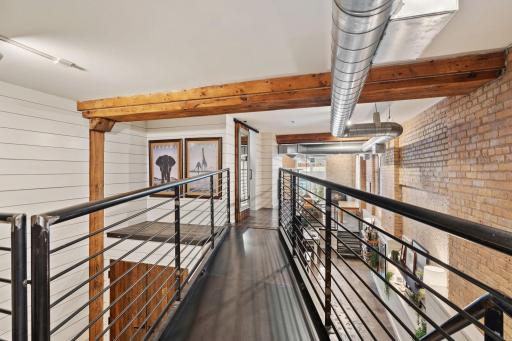 Catwalk leading to the primary walk-in closet