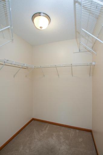 Primary walk in closet is large and has shelving in place for maxinimum storage