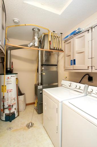 Laundry and mechanical area is just beyond the kitchen. Washer and dryer included!
