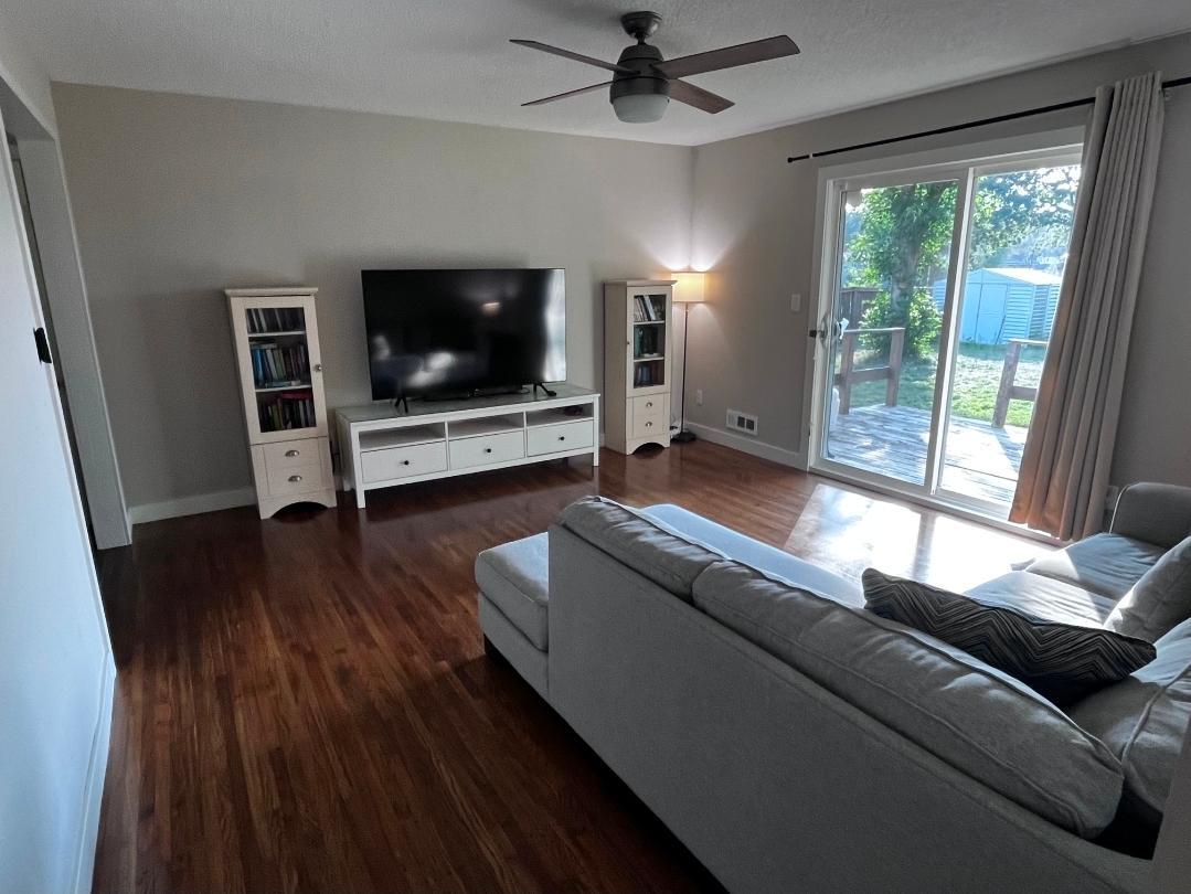 Living room that leads to deck