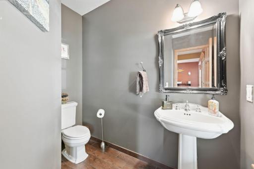 Convenient main-floor half bathroom adds functionality for everyday living and guests.