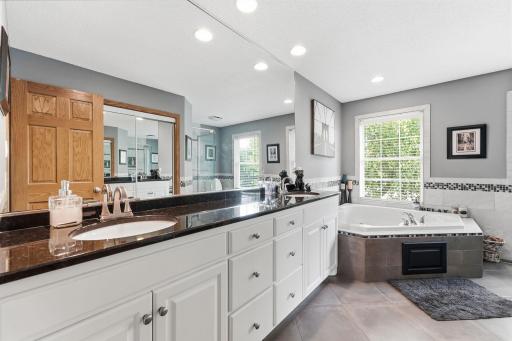 Dual sinks and large vanity area for easy morning routines.