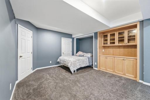 Built-in shelving creates a natural focal point while adding practical storage.