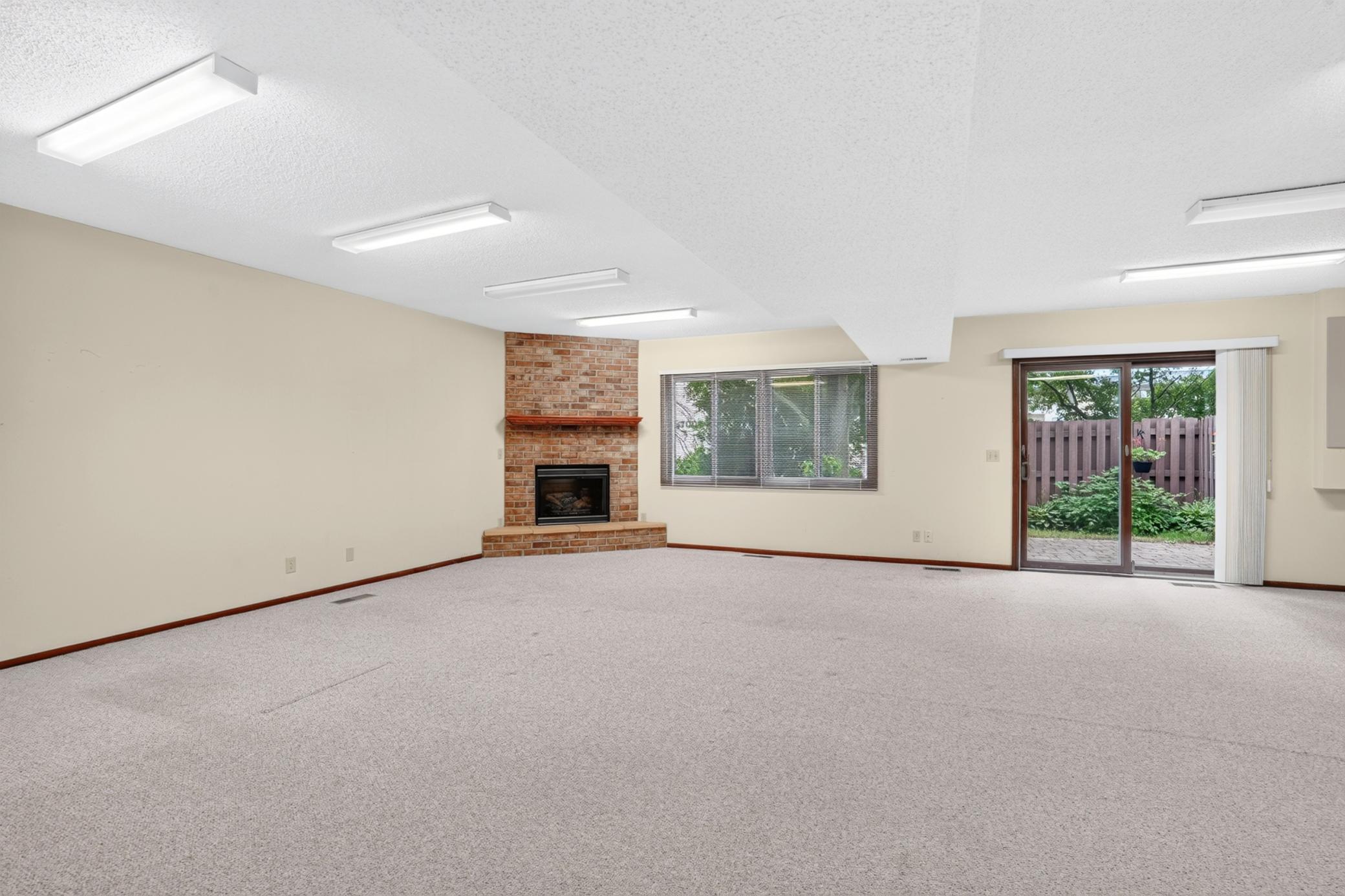 Huge walkout lower level family room with Gas Fireplace
