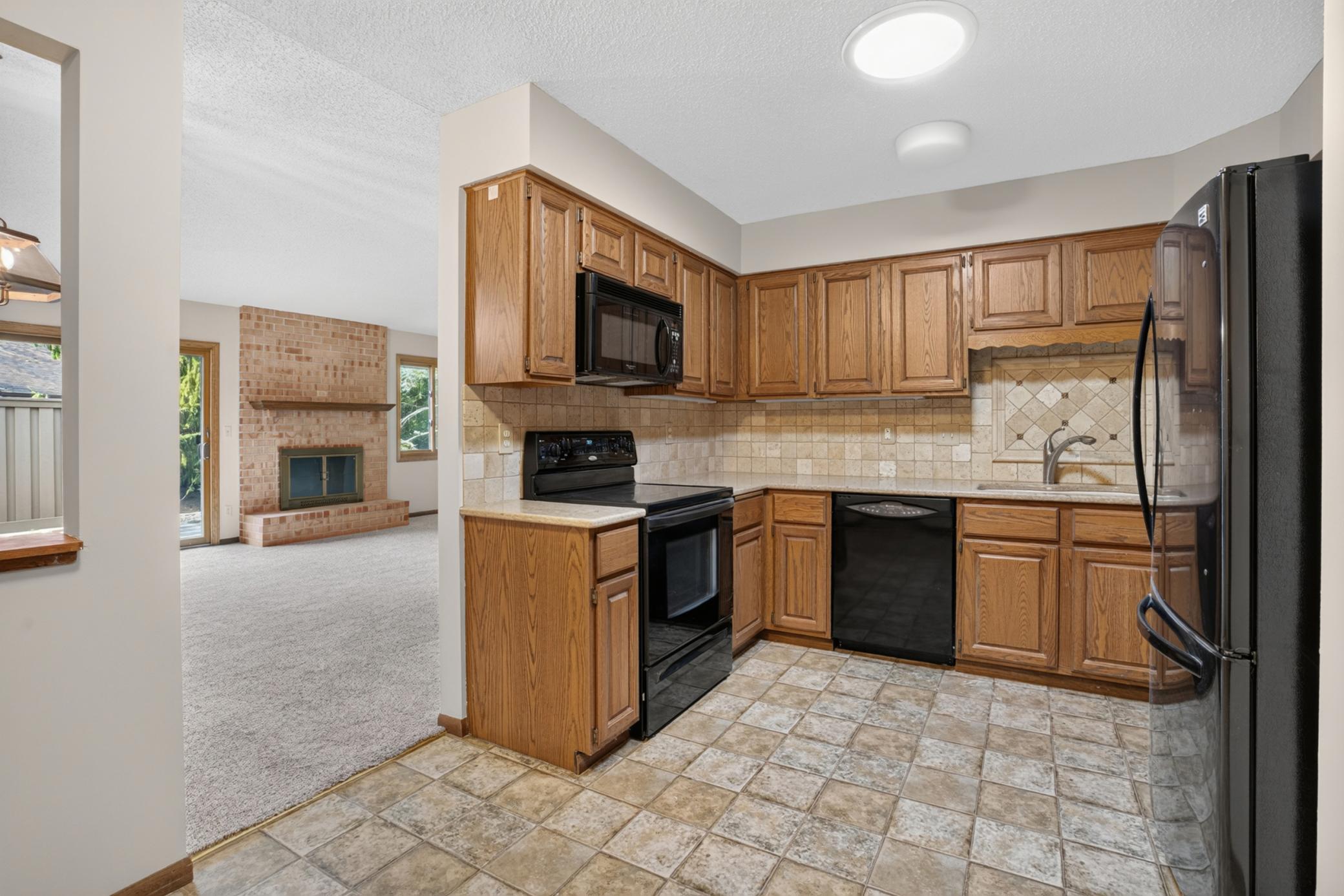 Kitchen opens to dining and main level for convenient entertaining