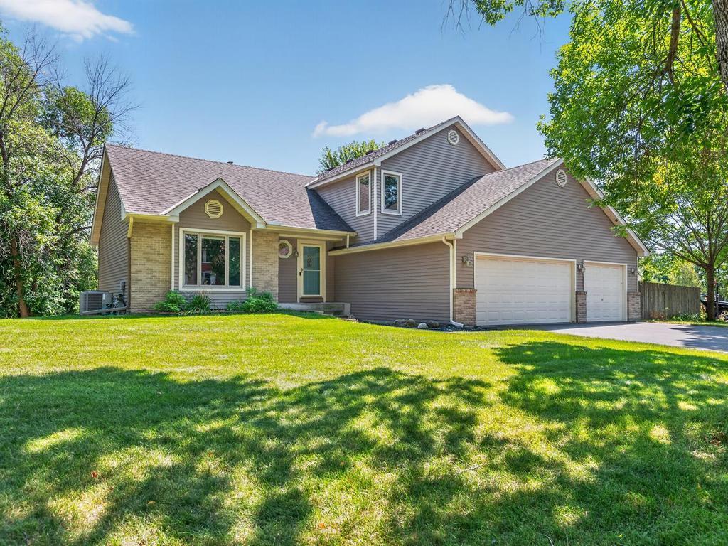 Welcome to 10615 52nd Avenue N, a 3-bdrm, 3-bath Plymouth home with 1,989 finished sq ft, an attached 3-car garage, two composite decks, wetland views and an unfinished walkout lower level.