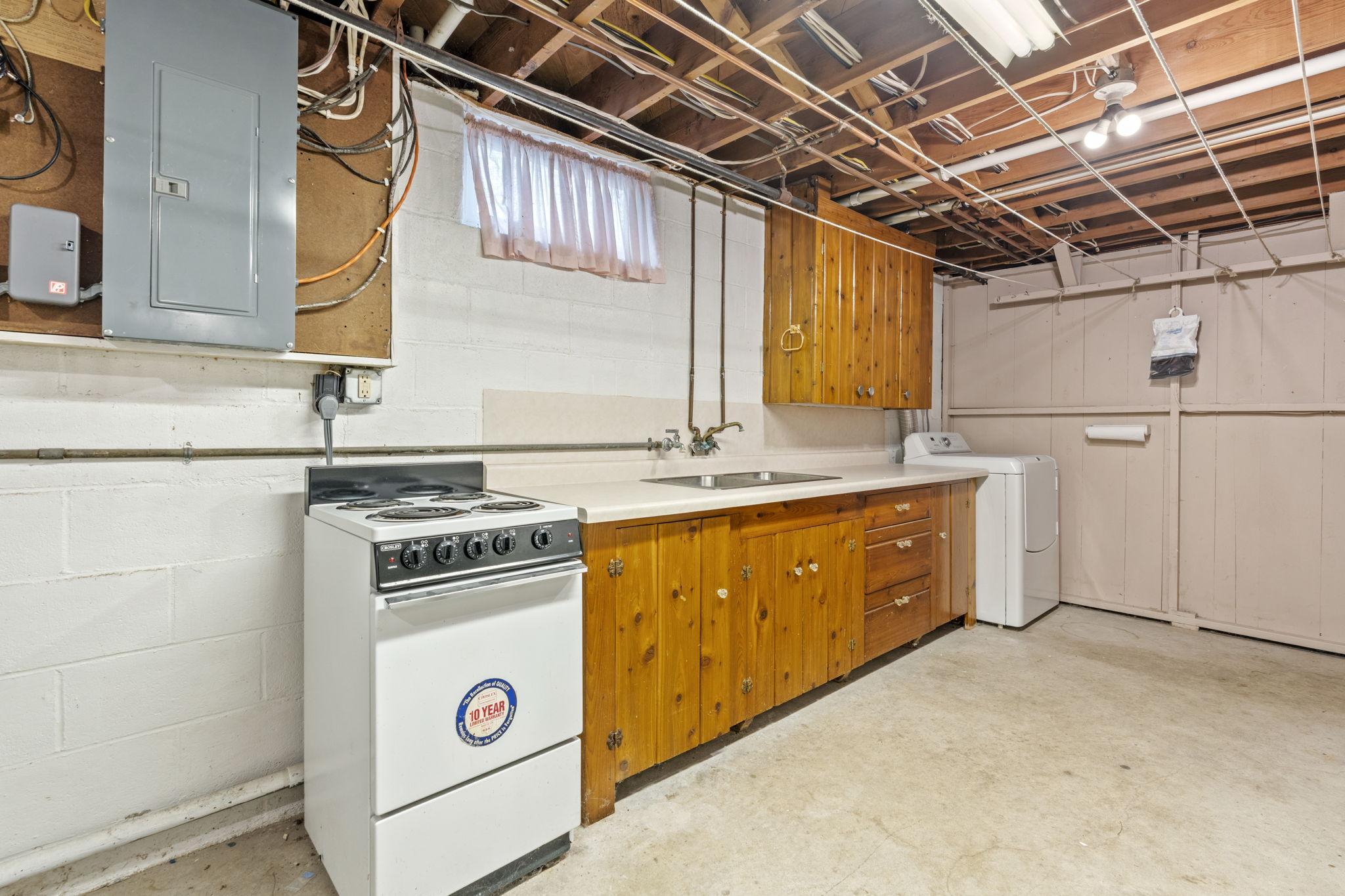 lower level second kitchen behind basement bar