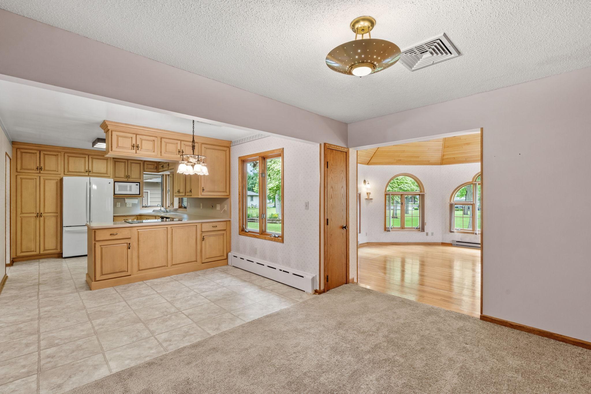 standing in room across from eat-indining room leading to gazebo