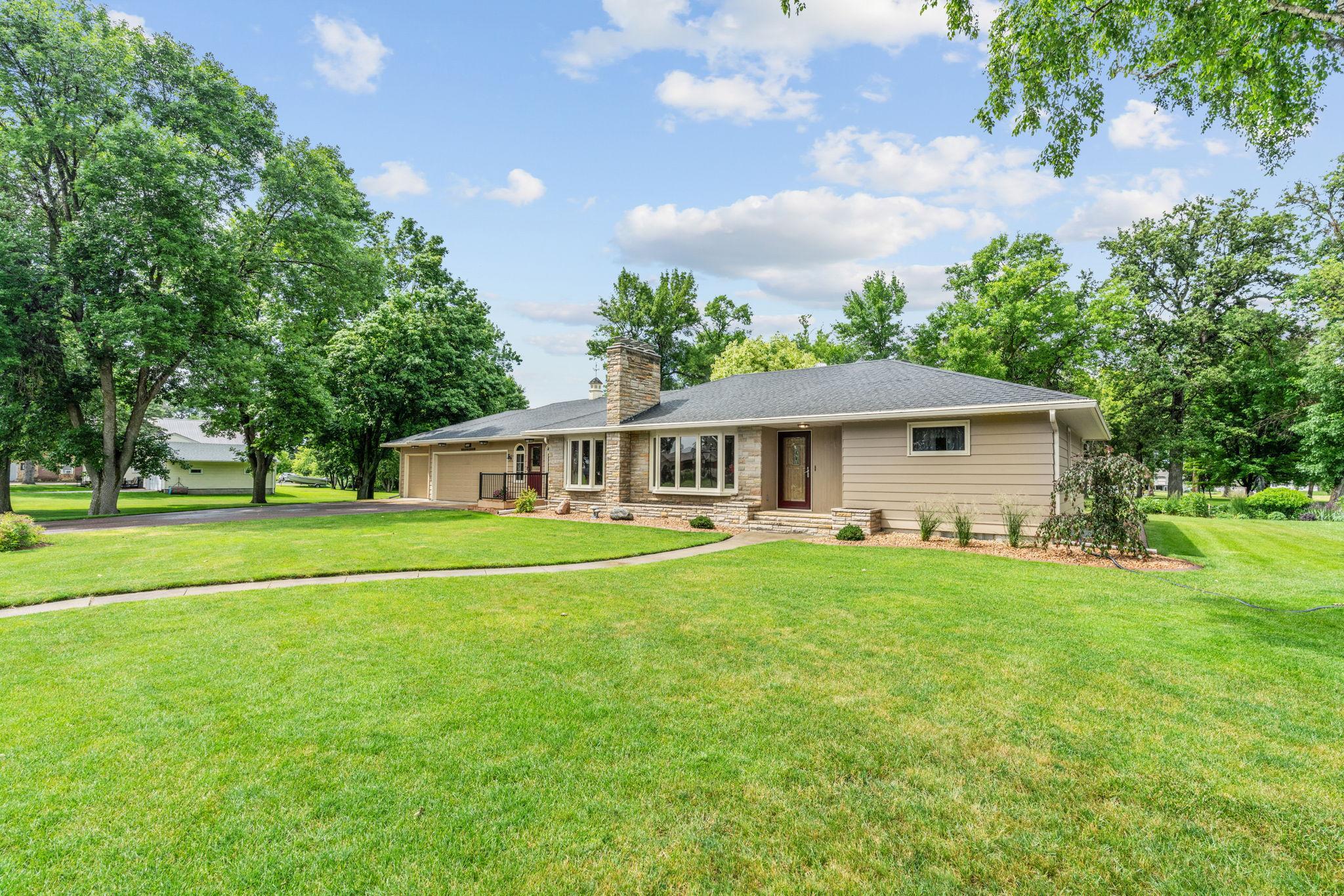 far away front of house with view of sidewalk