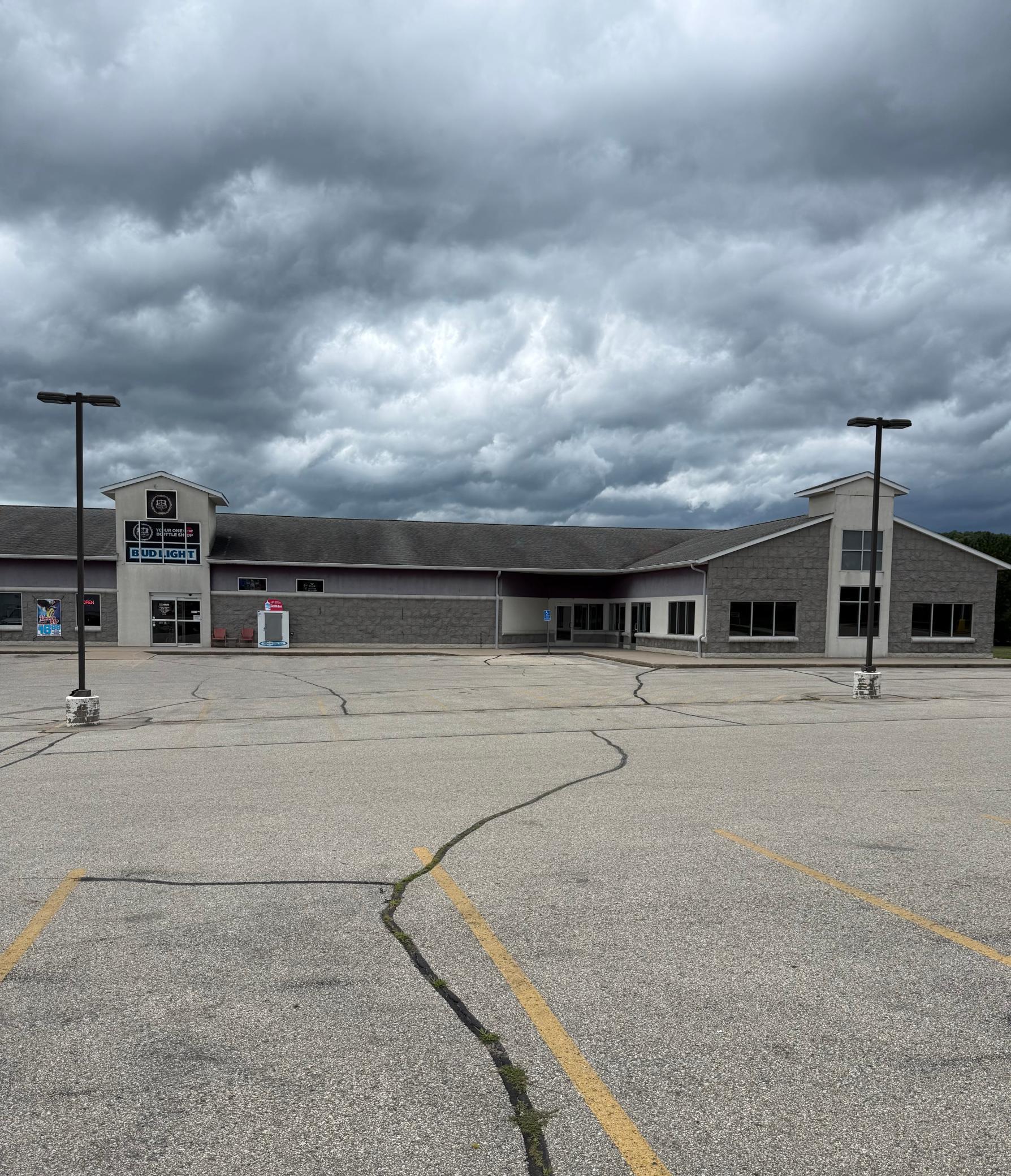 Full building photo: Lease spaces are on the right next to 52 Bottle Shop