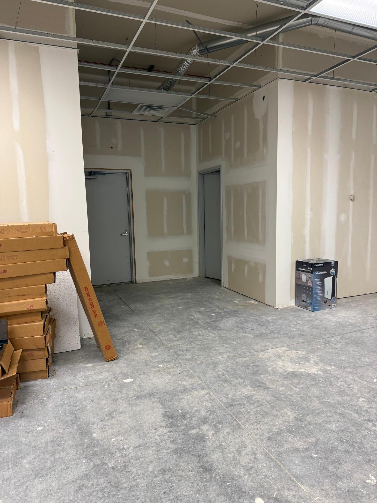 Lease Space C: Rear exit and bathroom.