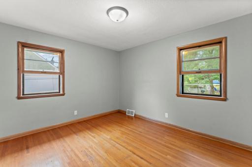 Two bedrooms on the main floor, both with original well kept hardwood floors.