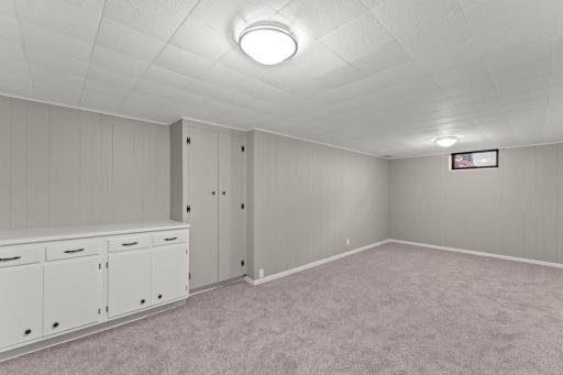 Basement with new carpet in the family room, den and bedroom.