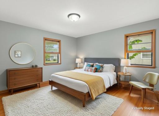 Virtually stage front bedrooom with hardwood floors