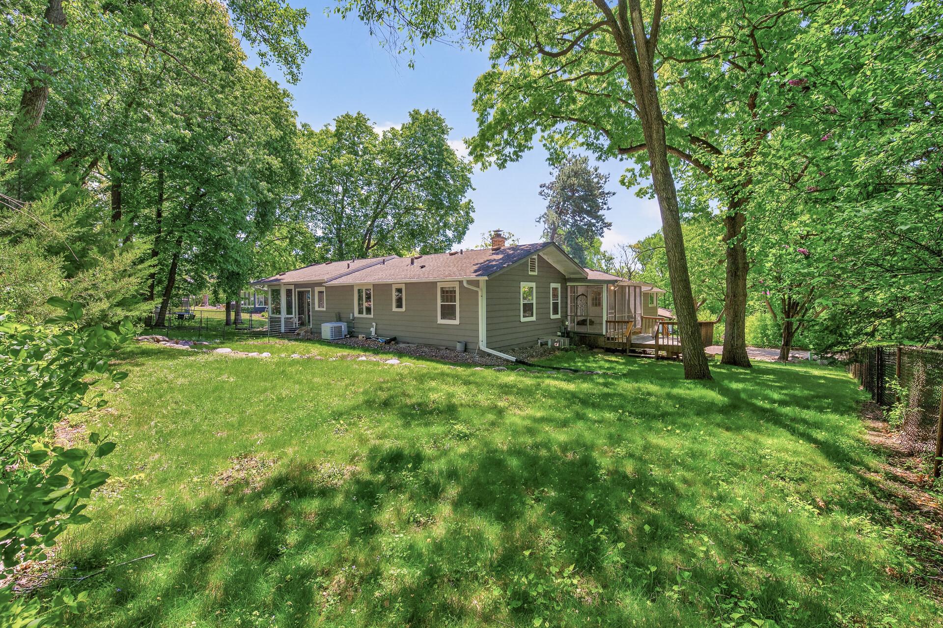 Marvelous Backyard: View to the back of home and yard with view to side yard