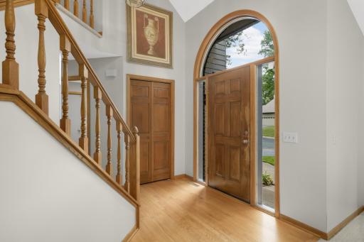 Vaulted main entry with hardwood floors
