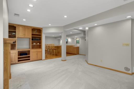 Lower level family room looking toward rec space with bar