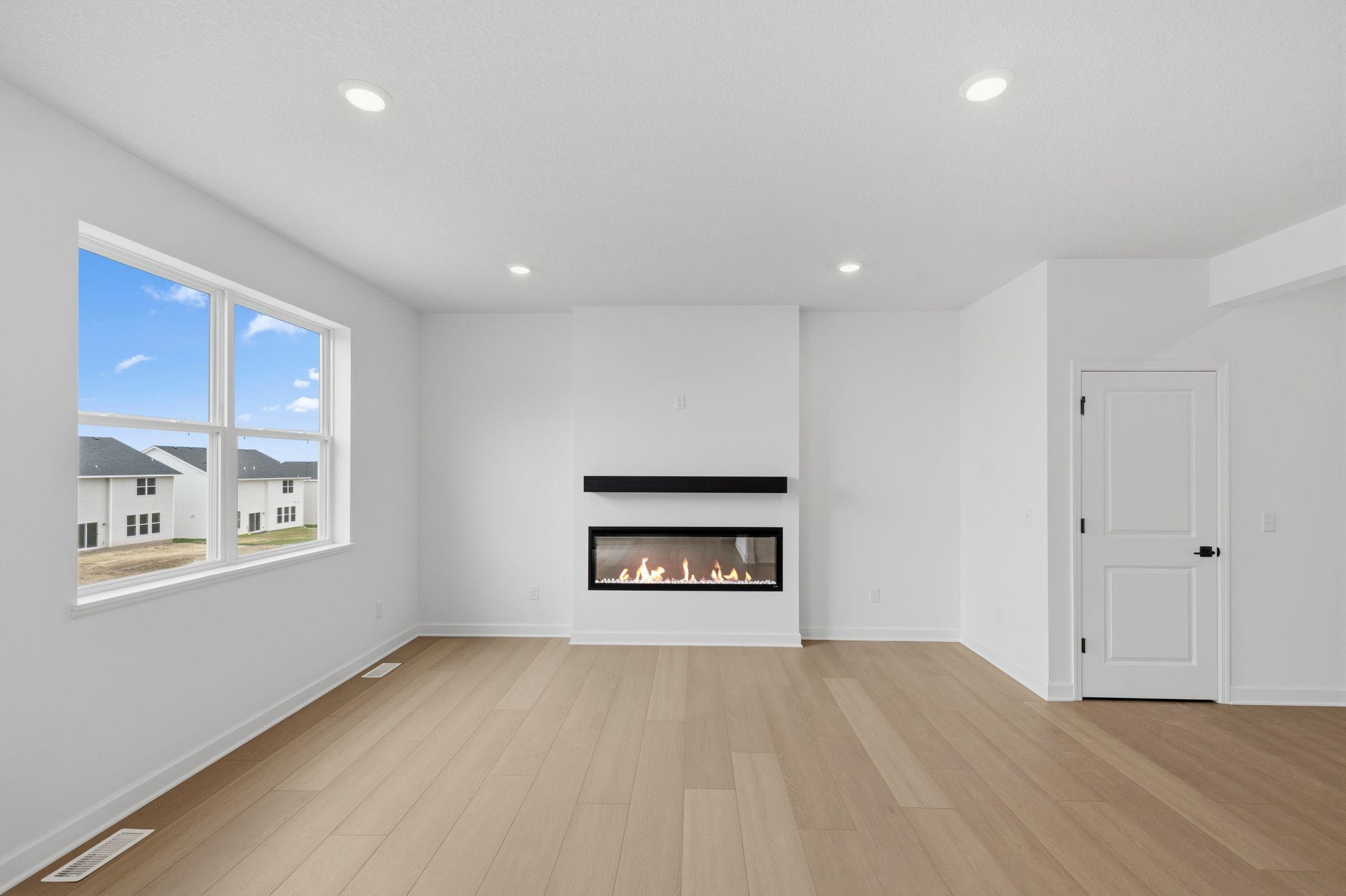 (Photo of a similar home, actual finishes may vary) The Great Room is the perfect place to take in a movie in comfort and style
