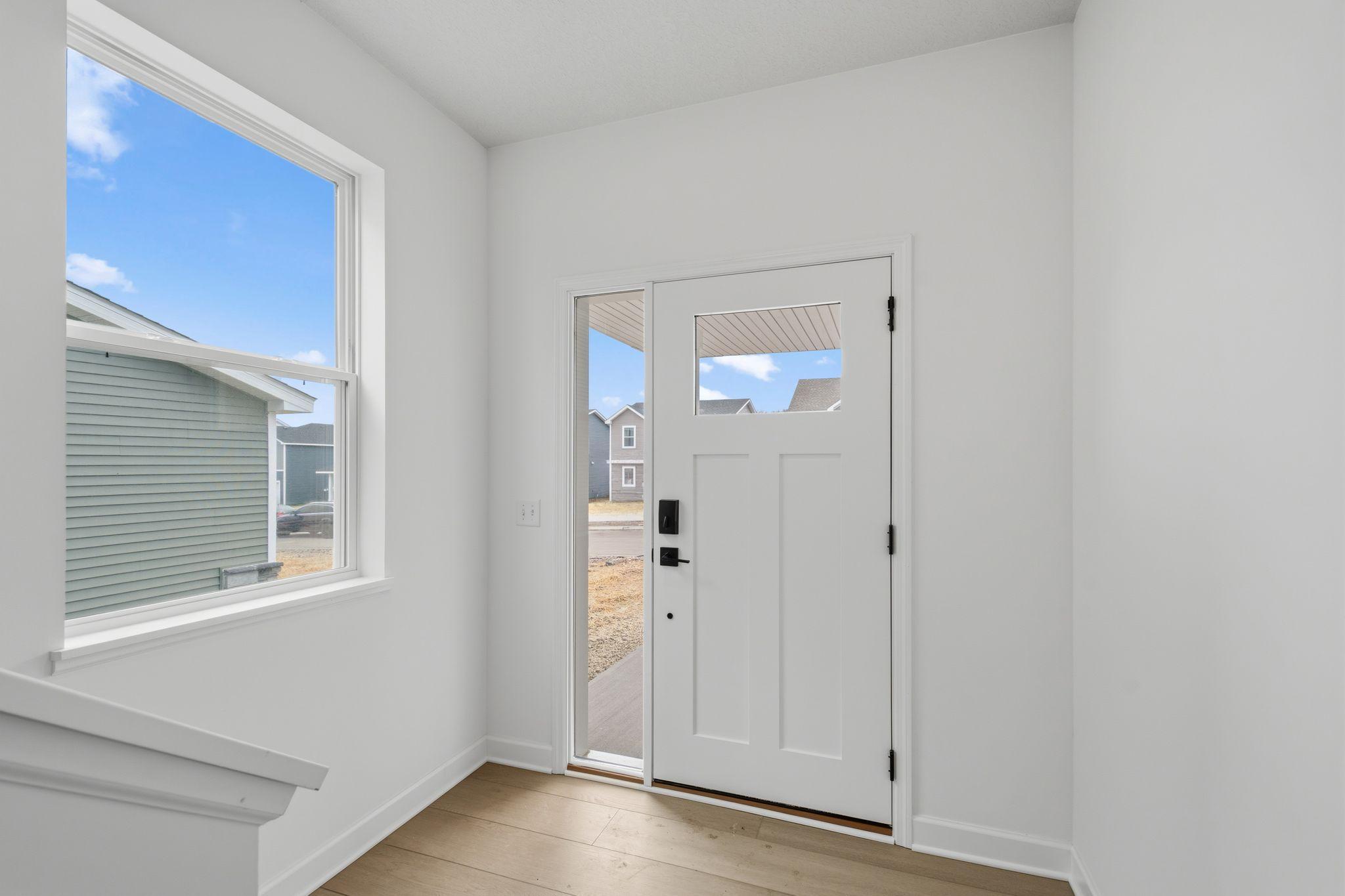 (Photo of a similar home, actual finishes may vary) The foyer allows for ease of access to all living spaces