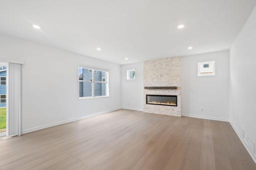 Wide windows bathe the living room in plenty of natural light