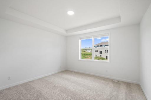 The owner’s suite is the ultimate retreat, boasting a private location at the back of the home with direct access to a full bathroom and walk-in closet.