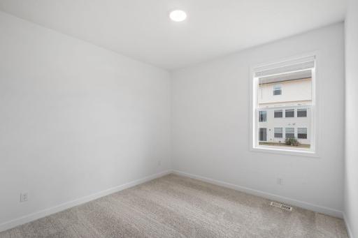 This bedroom provides a comfortable space where both guests and residents can rest, recharge and unwind away from the main living area.