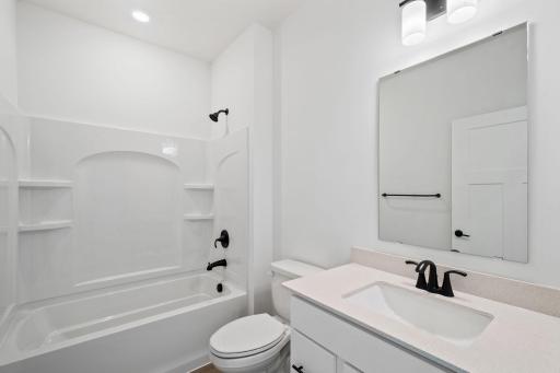 This bathroom boasts a convenient location near the front of the home, tucked away between bedroom 2 and the flex space.