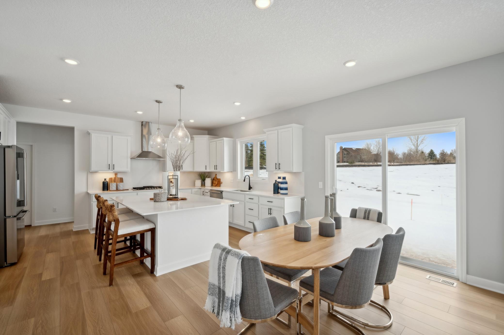 (Photo of model home, finishes will vary) Ample space next to the kitchen to add a dinning table!