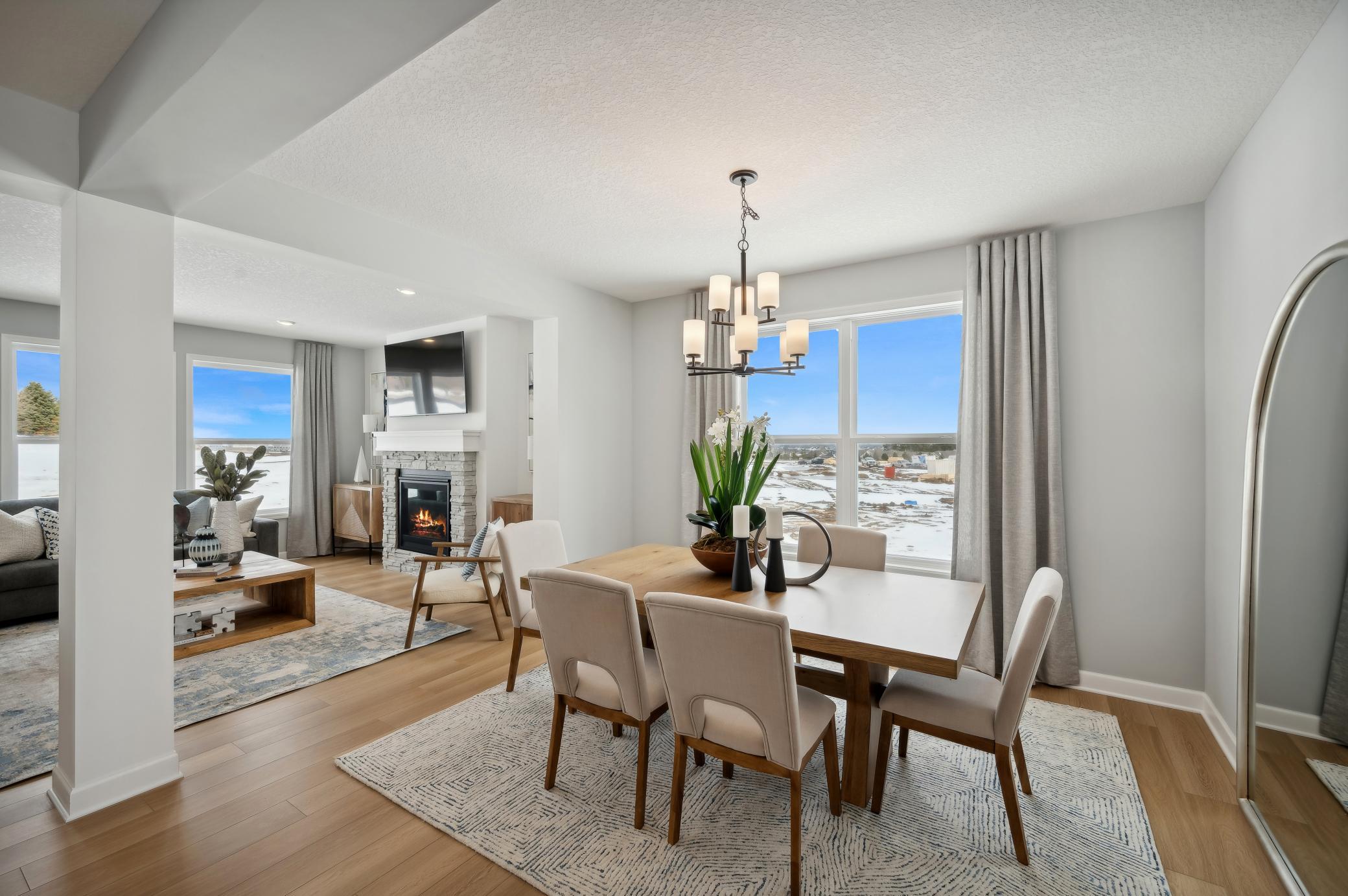 (Photo of model home, finishes will vary) This formal dining area is large enough to comfortably accommodate a 10-seat dining room table.