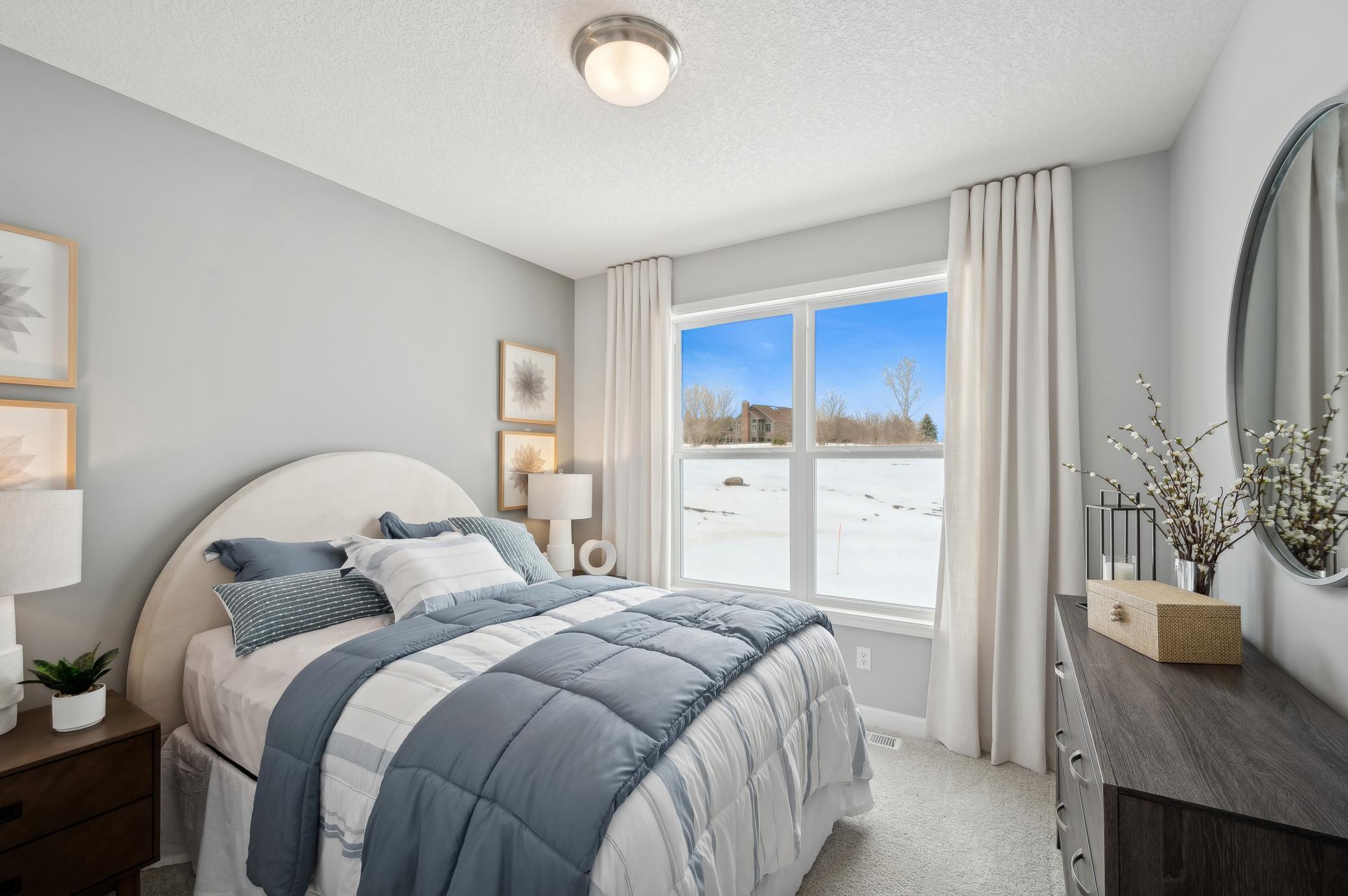 (Photo of model home, finishes will vary) This plan offers a secondary bedroom on the main floor! One of four generously sized secondary bedrooms with spacious closets.