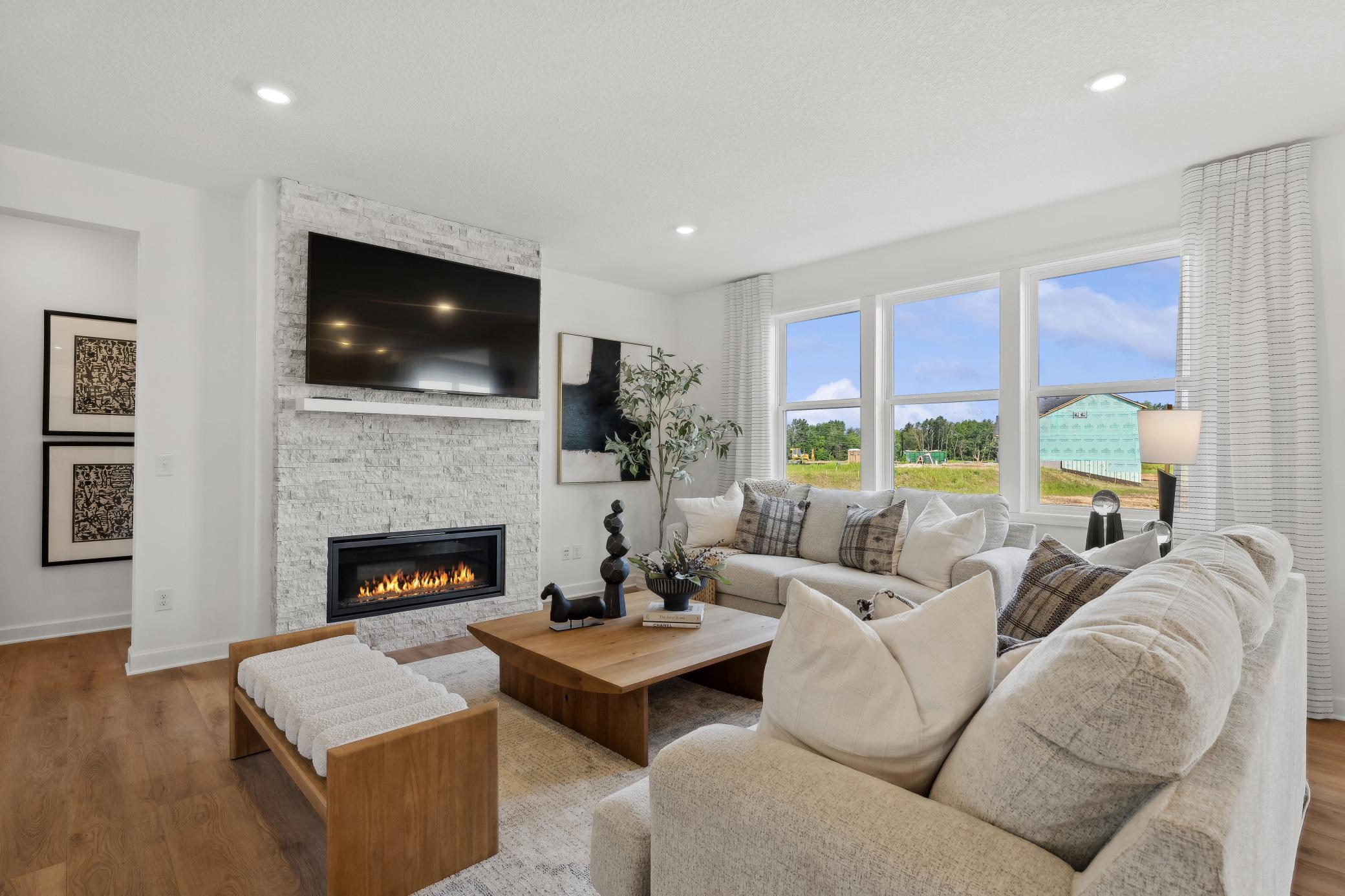 (Photo of model home, finishes will vary) It’s shown here with an electric center fireplace to add a warm glow