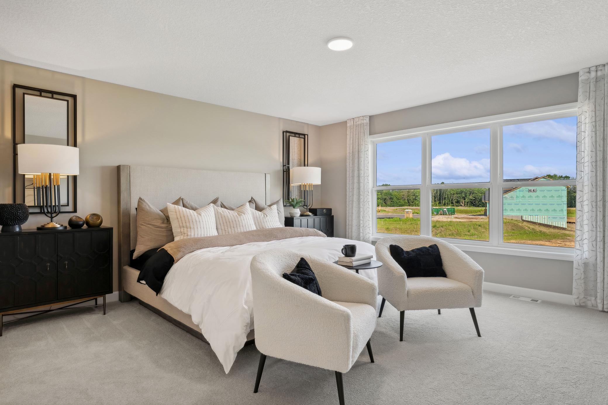 (Photo of model home, finishes will vary) The expansive owner’s suite is located on the second level, complete with a restful bedroom, an en-suite bathroom and two walk-in closets.