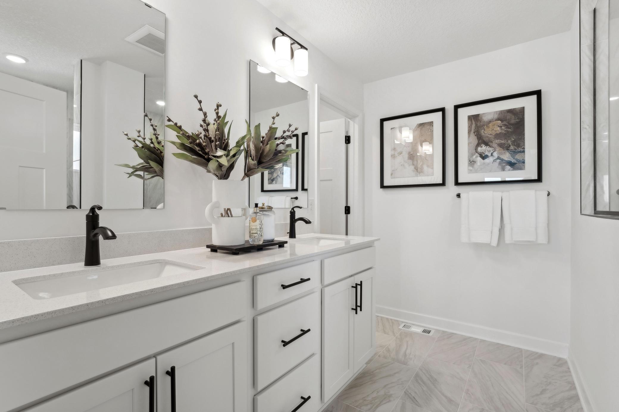 (Photo of model home, finishes will vary) .Dual sinks promote a streamlined morning routine