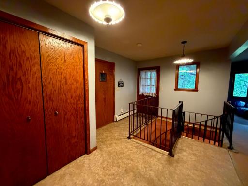 Access to front door and garage door off entryway.