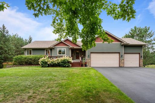 Welcome home to 14954 Durant Street NE. Your oasis in the woods!