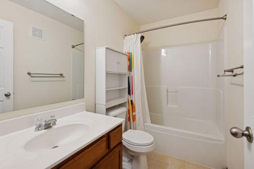 2nd upper level bath in the hallway with tub