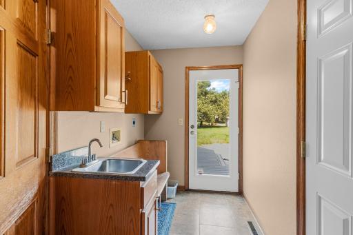 Main level mudroom with access to back yard and attached 3 car garage