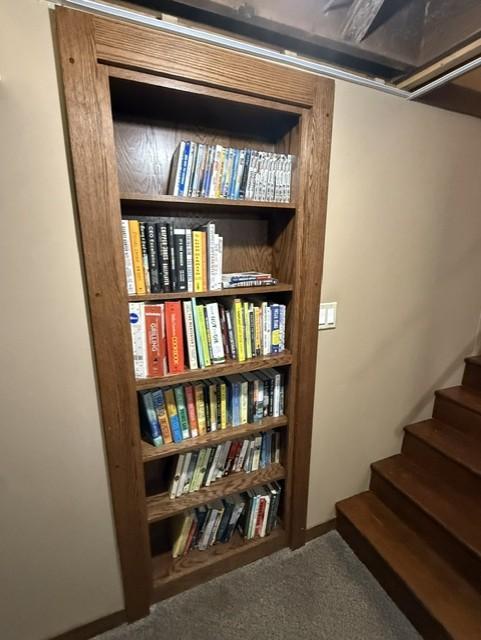 Staircase is a hidden access to the storage area.