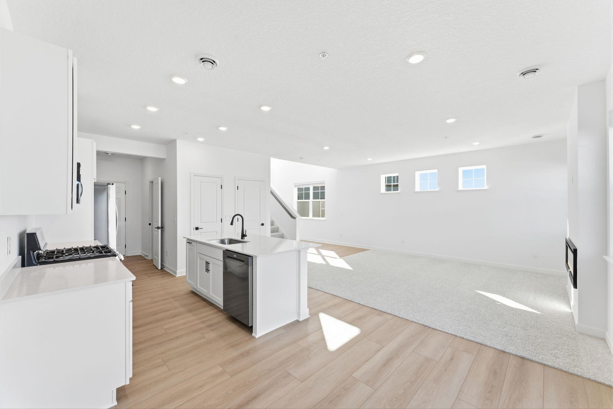 (Photo of a similar home, actual finishes may vary) The dining room enjoys direct access to the patio for seamless indoor-outdoor parties