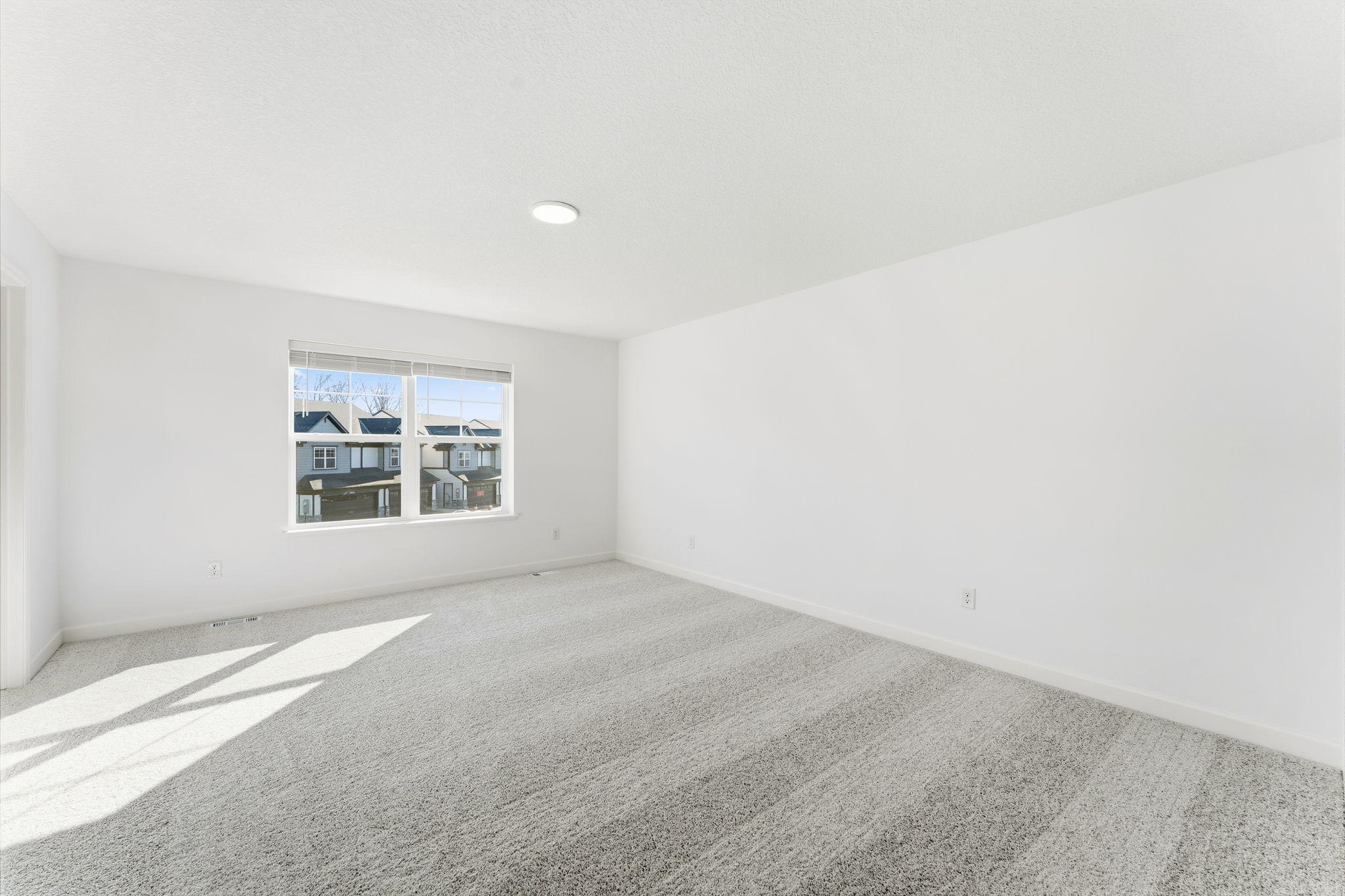 (Photo of a similar home, actual finishes may vary) Abundant natural light streams in from the large windows