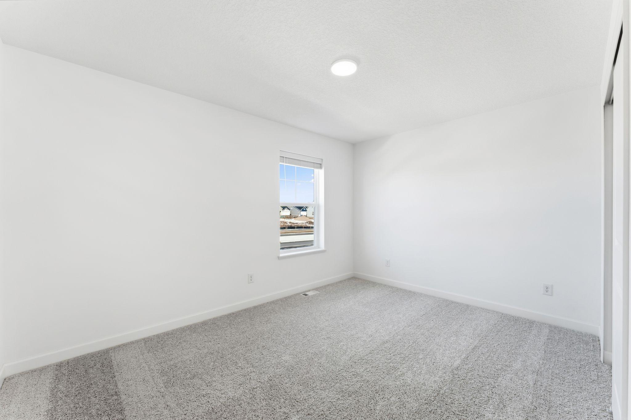 (Photo of a similar home, actual finishes may vary) Each secondary bedroom includes premium wall-to-wall carpeting with 6 lb padding for enhanced comfort and a convenient closet