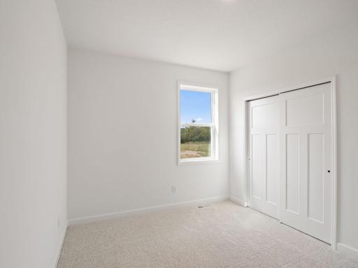 Either of the two secondary bedrooms can be transformed to suit the homeowner’s evolving needs, shown here as a custom office for work projects.