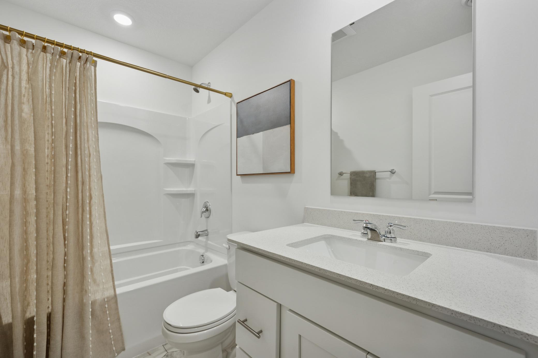 (Photo is of a model home, finishes will vary) This home features a full bath in the basement!