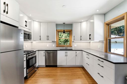 Gas range, mic, two kitchen windows