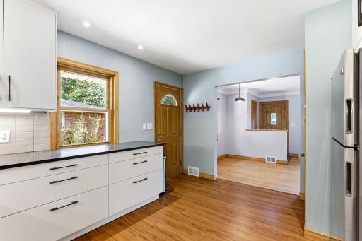 Kitchen open to DR. Side door to driveway