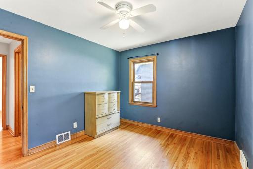 Primary BR with two windows, HWF, ceiling fan