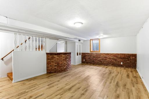 Brick bar and 1/2 brick wall, egress window in room