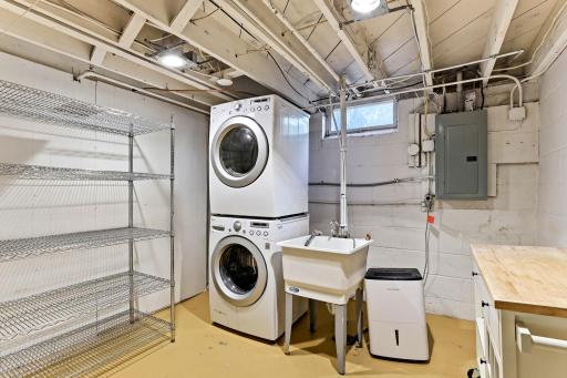Laundry has stacking W/D, shelving can stay