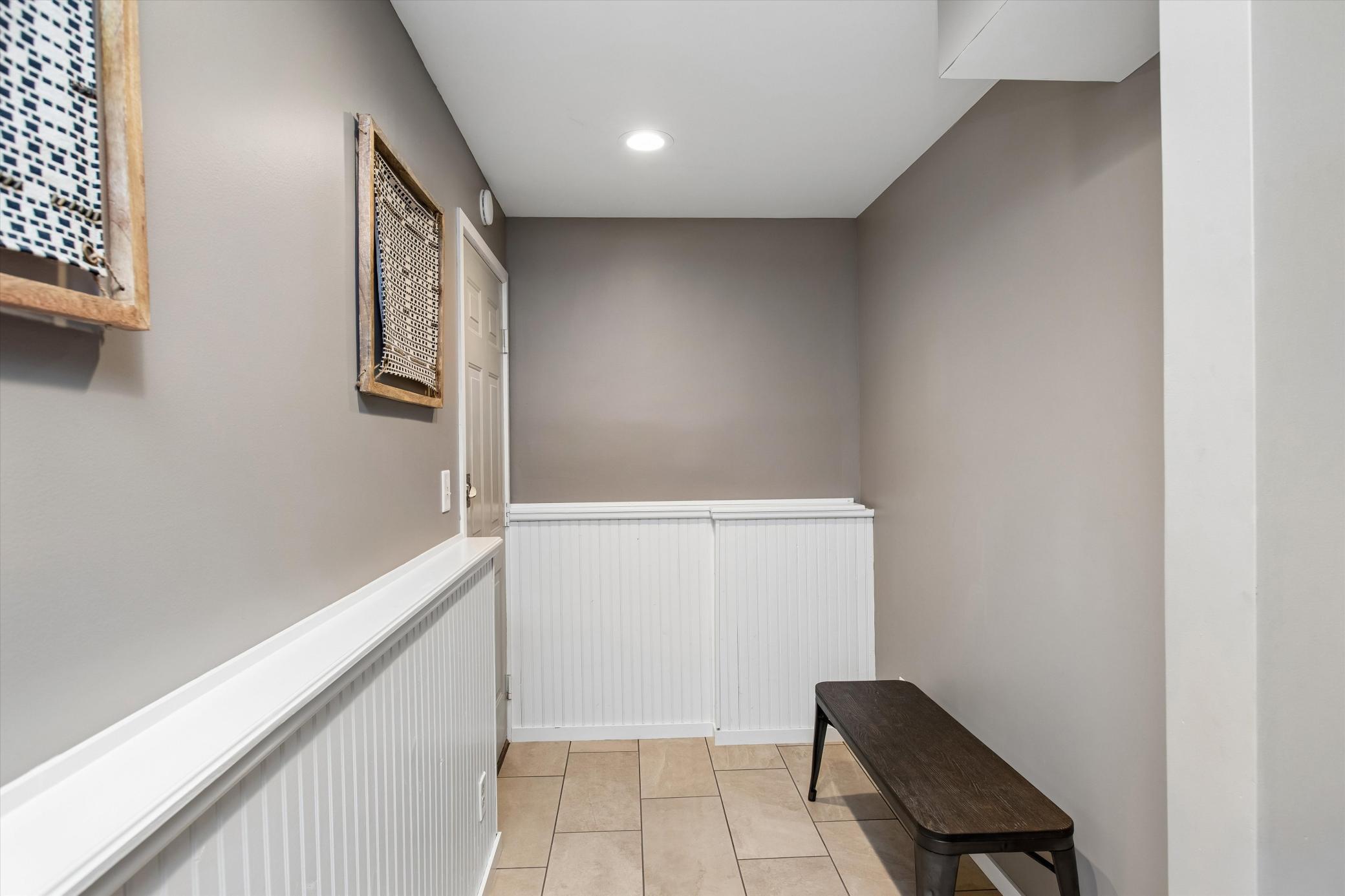 Lower-level has back hall that leads to garage